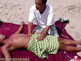 Nipple & penis massage on a public beach