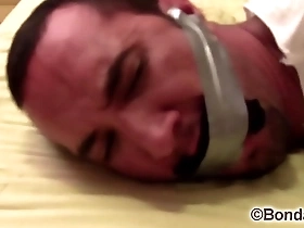 Victor sockgagged and tapegagged tight and captured with socks inside his mouth wrapped the tape around his head preview